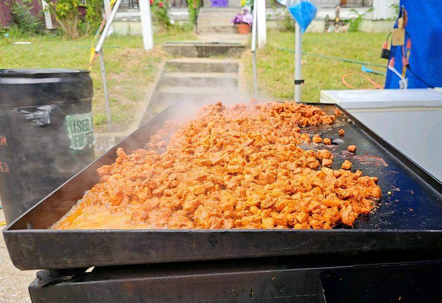 Meat cooking on the griddle at a Fiesta food vendor